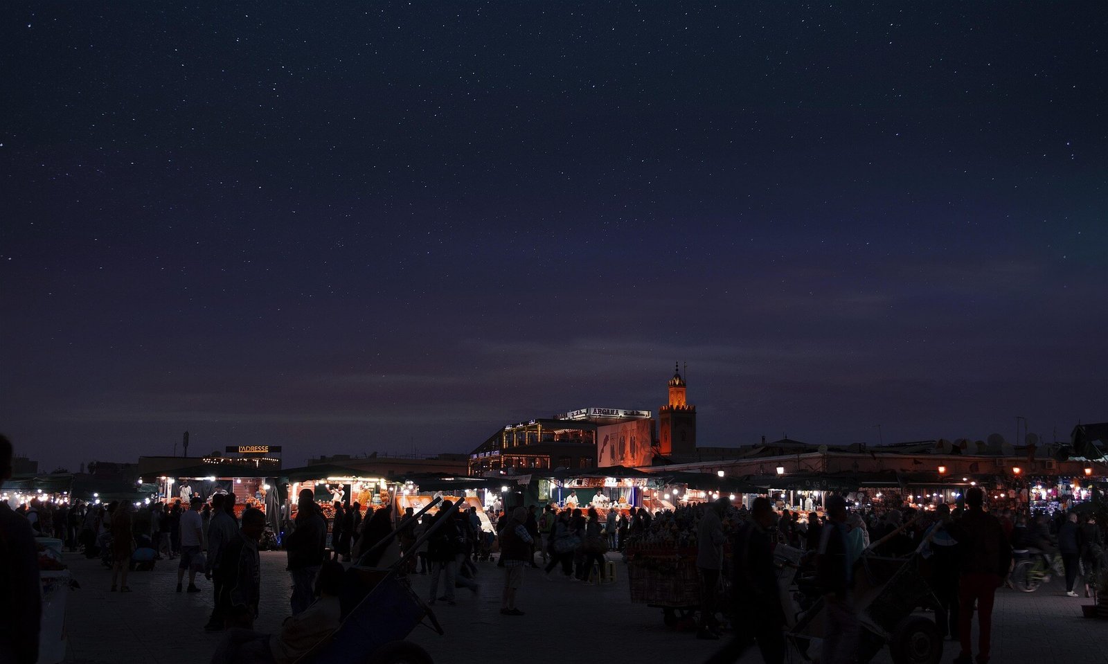 Jemaa el-Fnaa square lit up at night in Marrakech