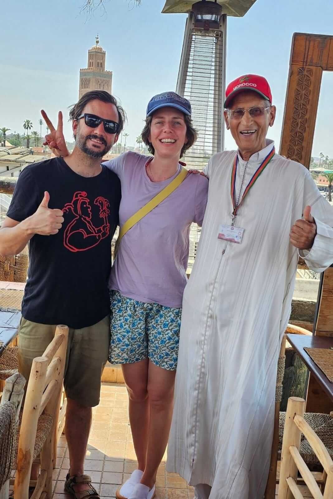 Happy travelers enjoying a private guided tour in Marrakech Medina
