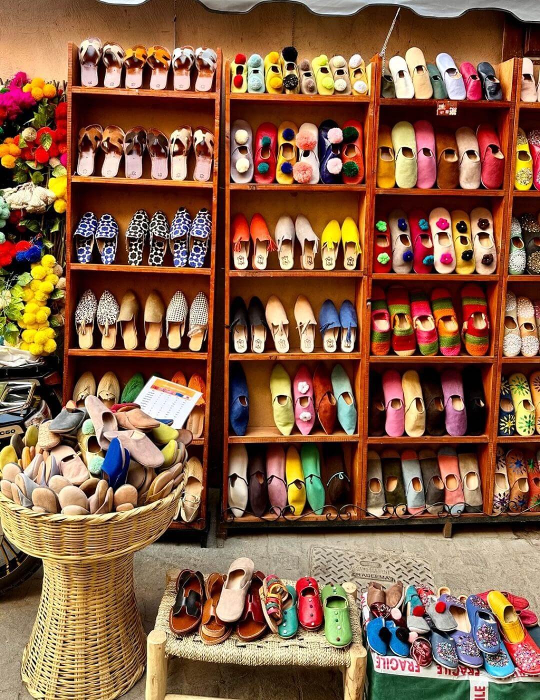Handmade Moroccan leather babouches displayed in Marrakech Medina during a private guided tour