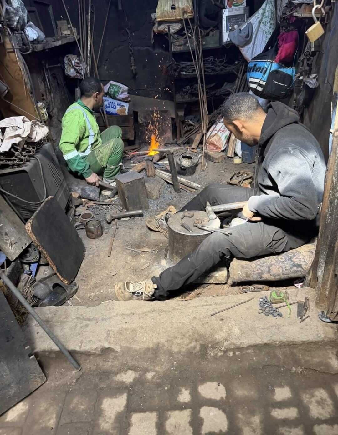 Traditional Moroccan blacksmith working inside Marrakech Medina