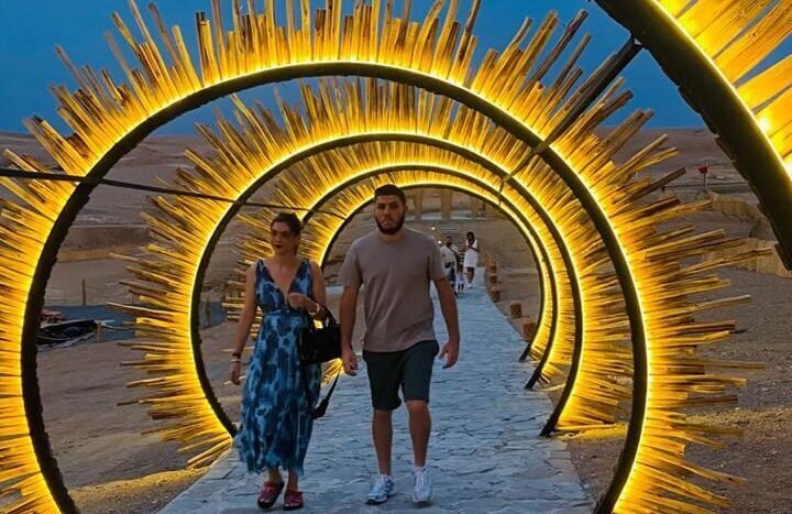 Couples enjoying a sunset moment together in the Agafay Desert near Marrakech
