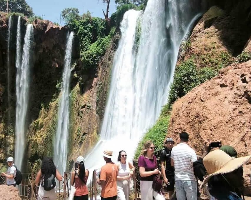 Tourists viewing Ouzoud Waterfalls on shared group excursion Morocco