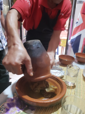 Traditional Moroccan tangia being served in Marrakech