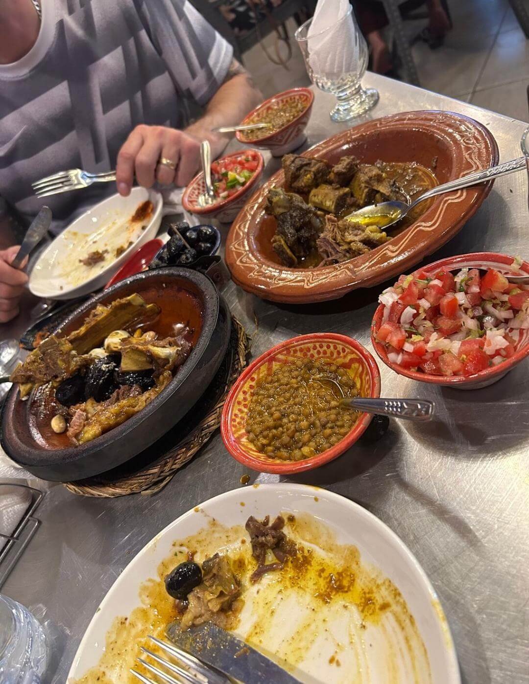 Traditional Moroccan tagine and salad spread in Marrakech
