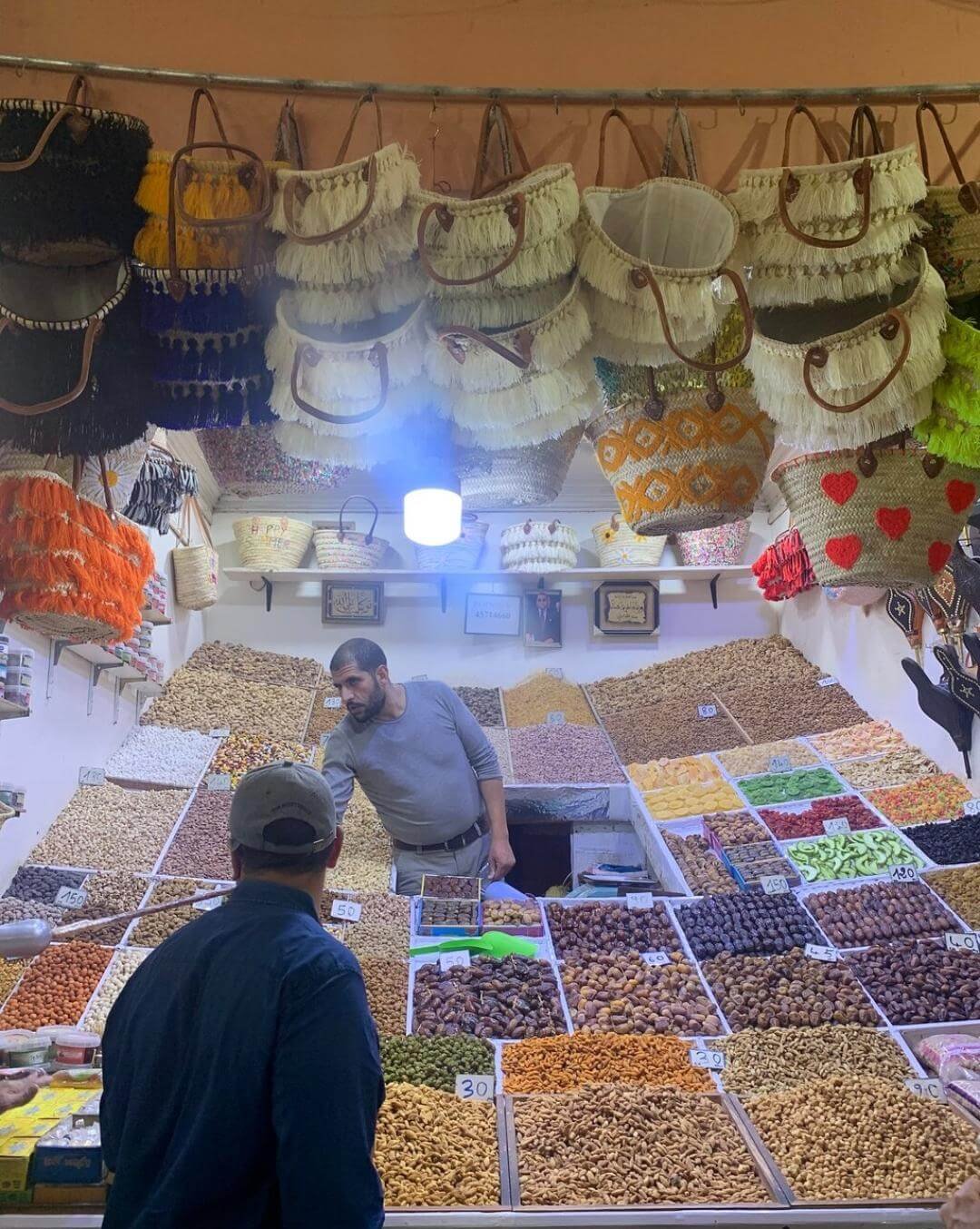 Vendor at a traditional dry fruits shop in Marrakech