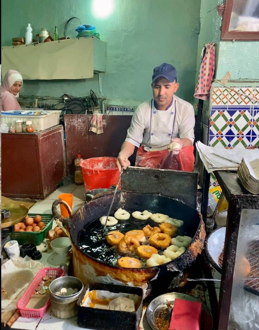 Local chef cooking at a Marrakech food stall