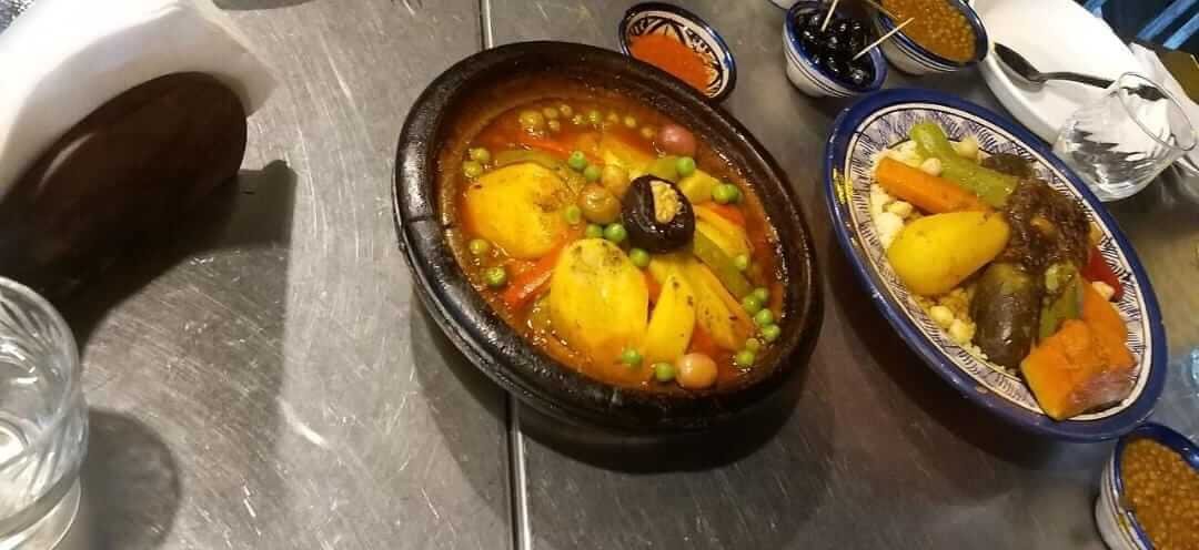 Traditional tagine served on a wooden table in Marrakech