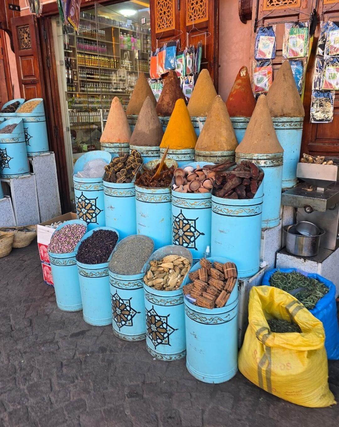 Traditional spice shop with hanging goods in Marrakech