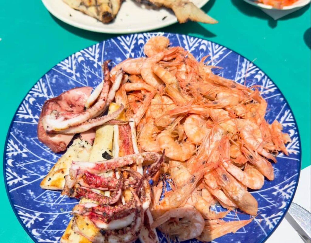 Freshly grilled fish plate served at a seaside restaurant in Essaouira, Morocco