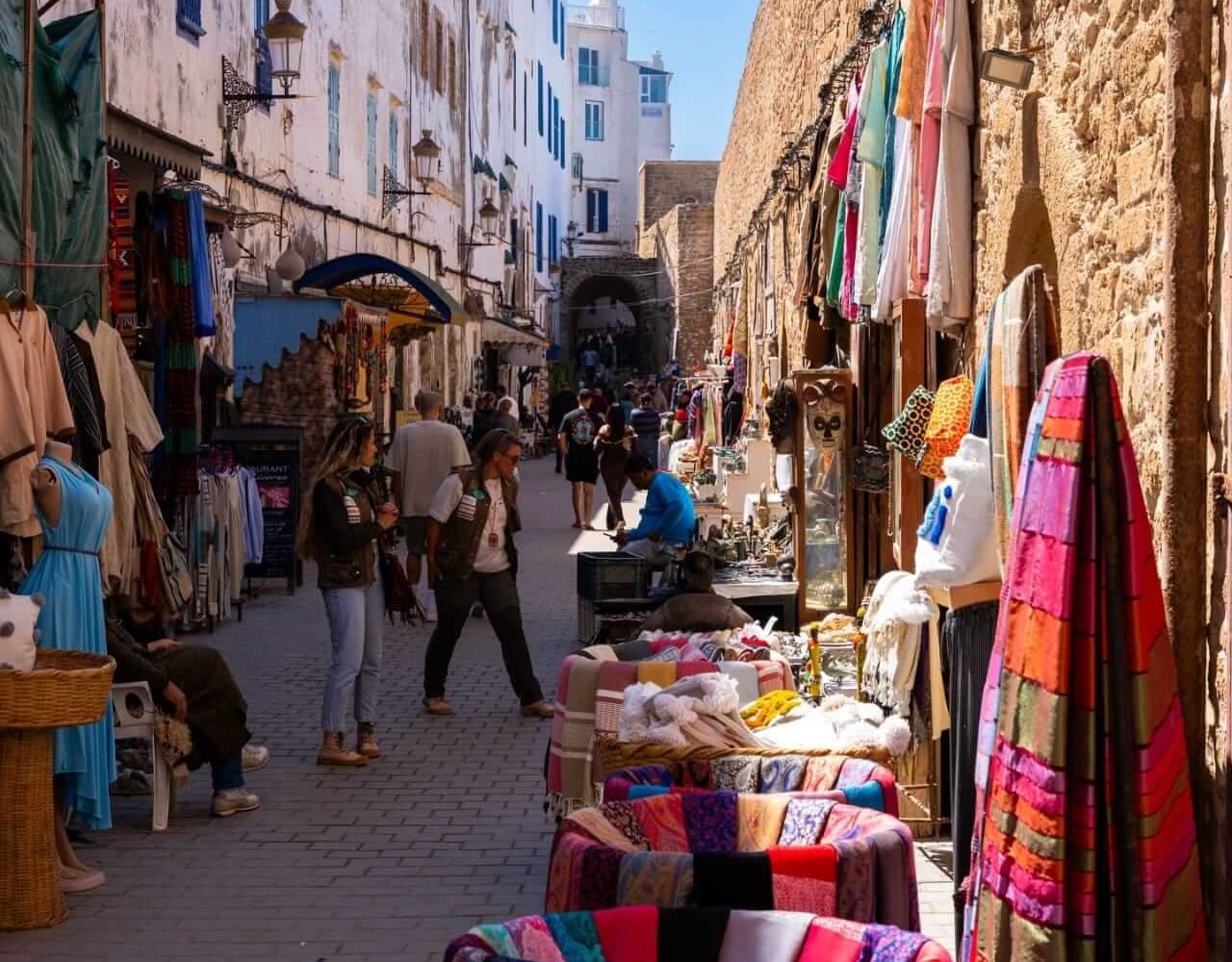 Narrow street in Essaouira's old medina lined with traditional shops