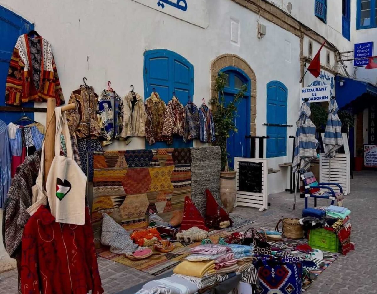 Charming narrow street in Essaouira lined with local shops