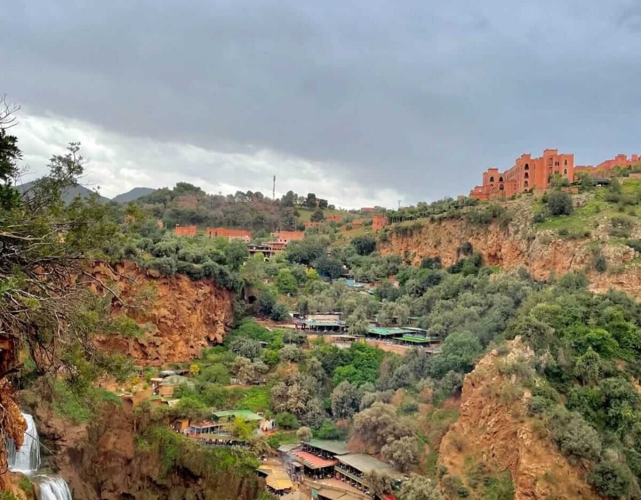 Panoramic canyon view of Ouzoud with scattered cascades and village below