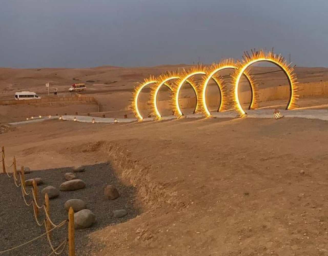 Illuminated fire ring installation in the Agafay Desert at dusk