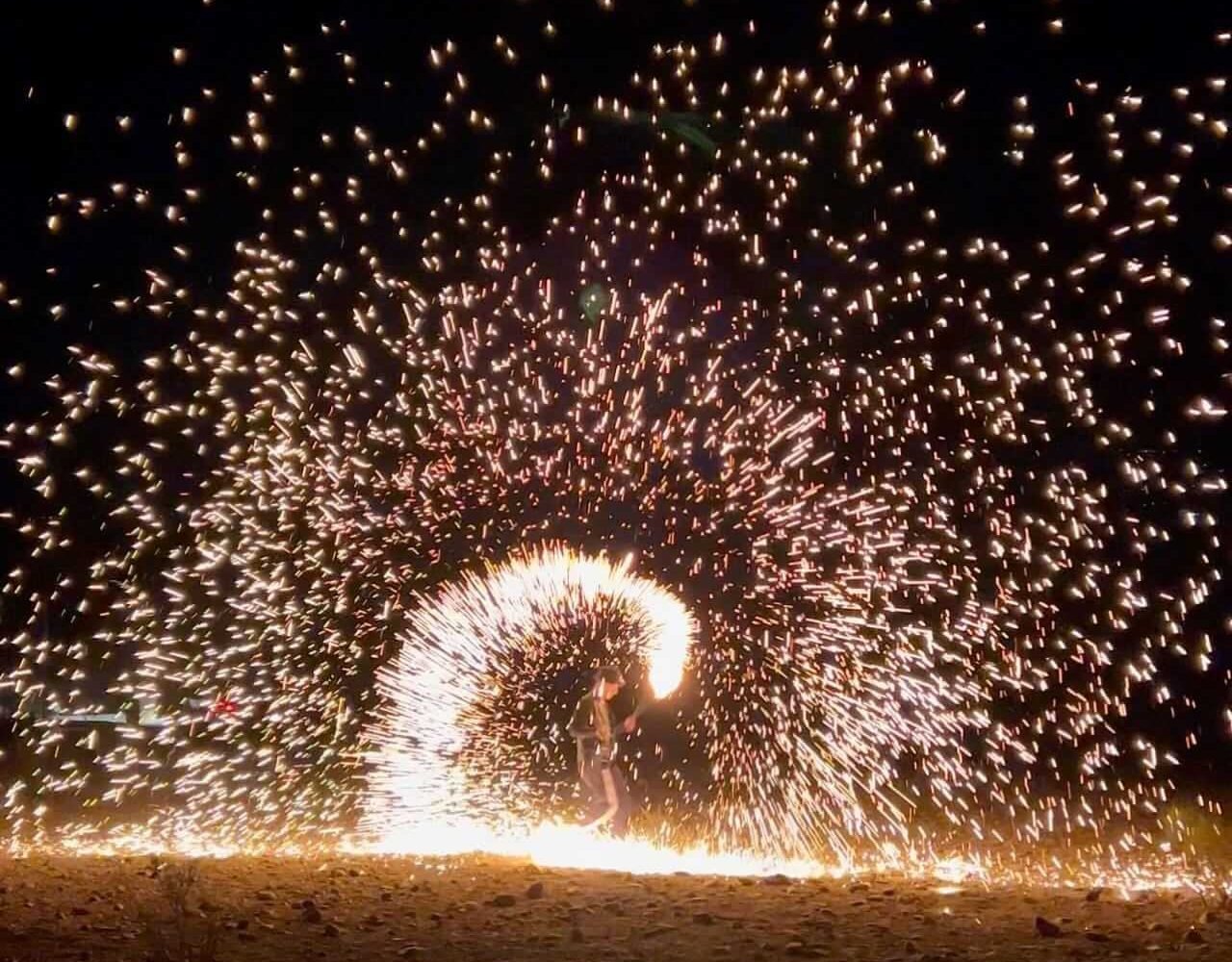Quad bike kicking up sand at night in the Agafay Desert