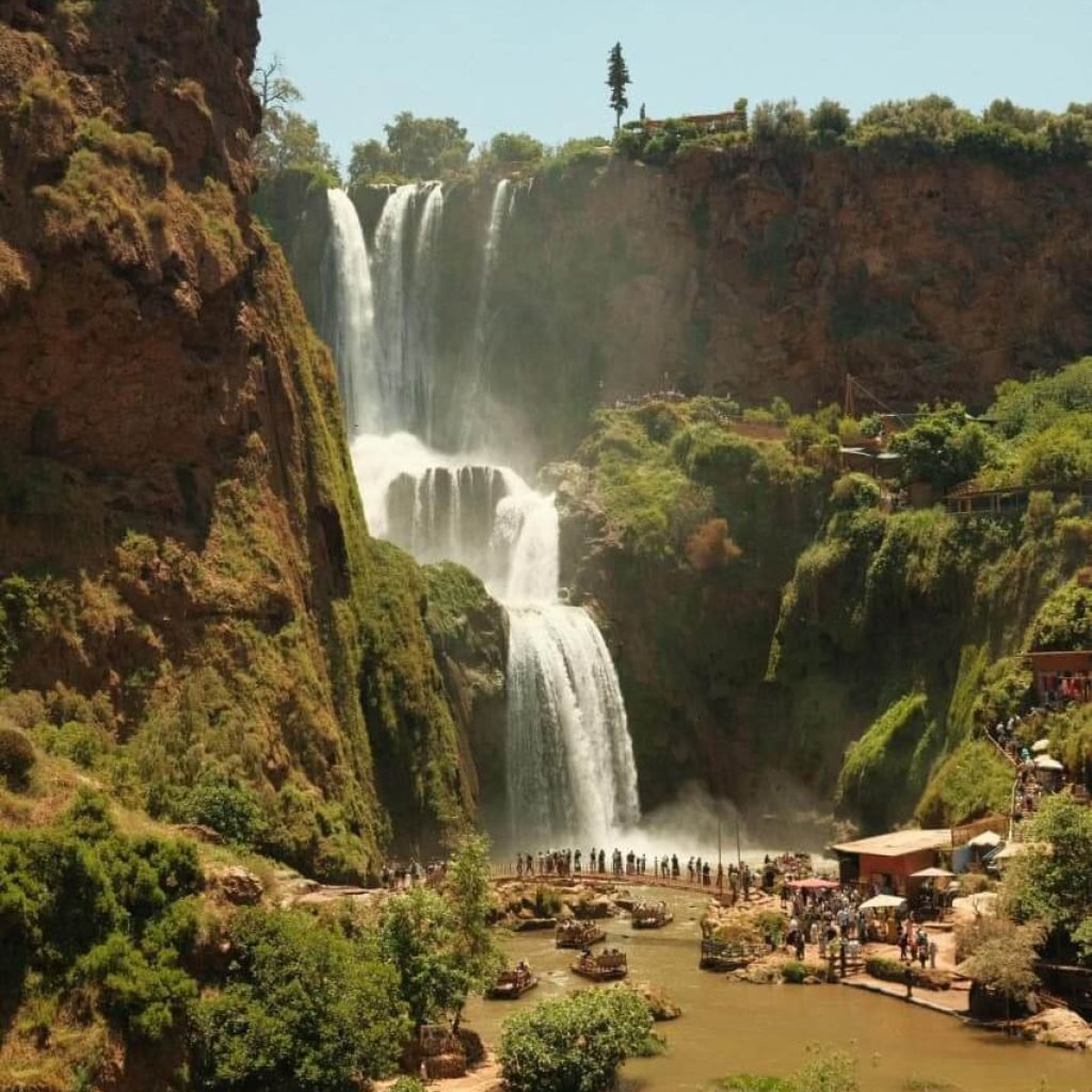 Ouzoud Waterfalls cascading through green cliffs in Morocco