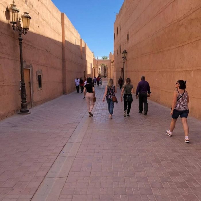 Licensed local guide leading a private Marrakech Medina guided tour through the traditional souks