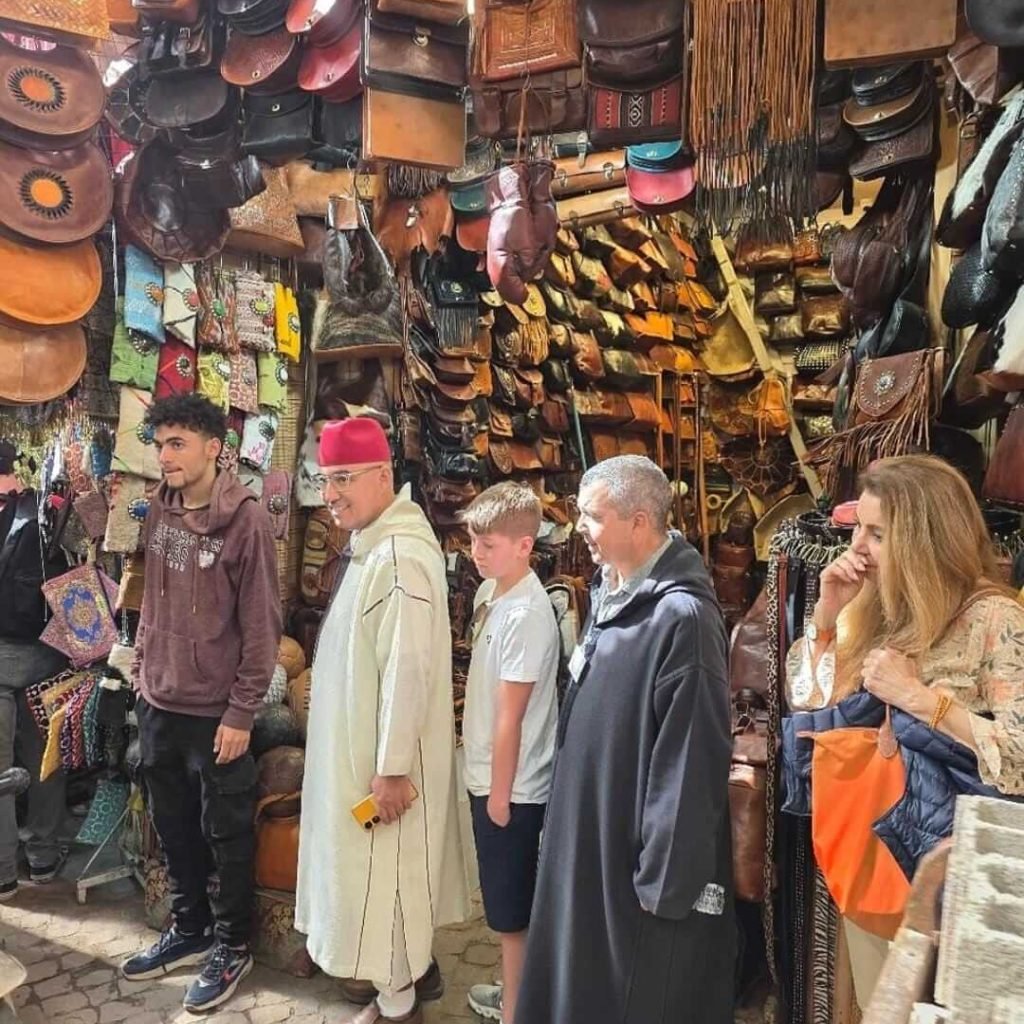Tourists exploring leather goods souk with private guide in Marrakech