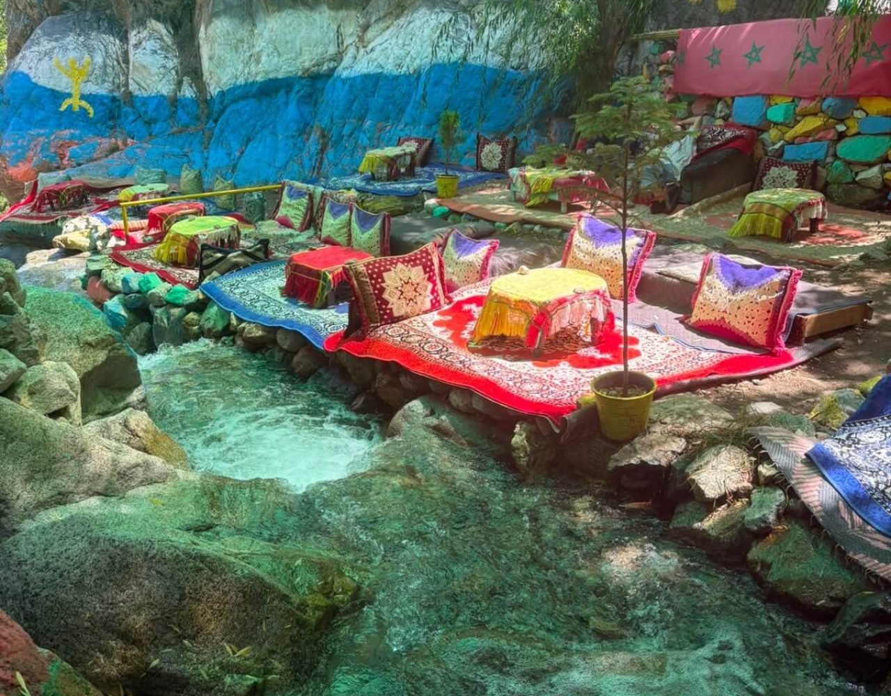 Turquoise natural pool under a green canopy in Ourika Valley