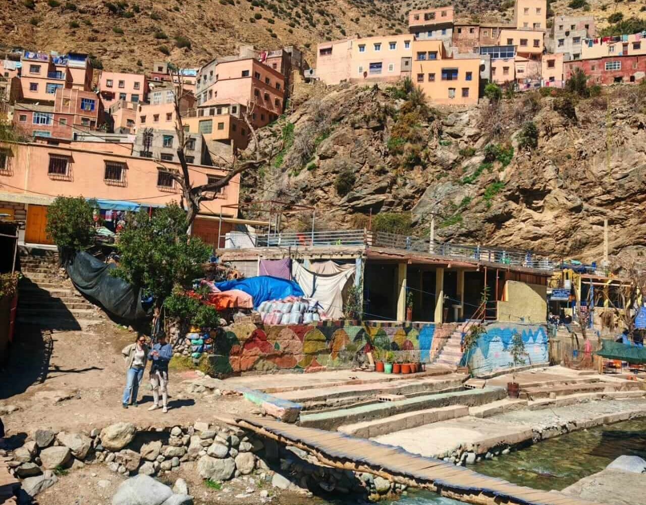 Traditional earthen village in the Ourika mountains under a blue sky